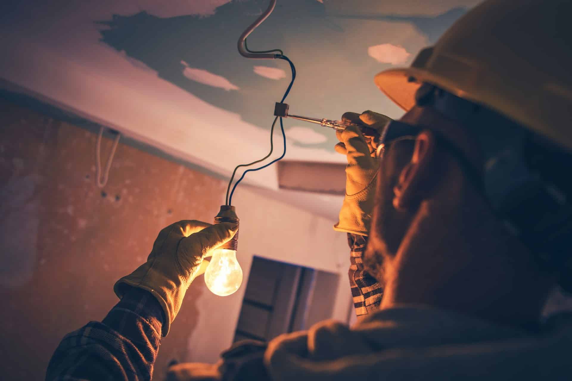 electrician fixing lighting